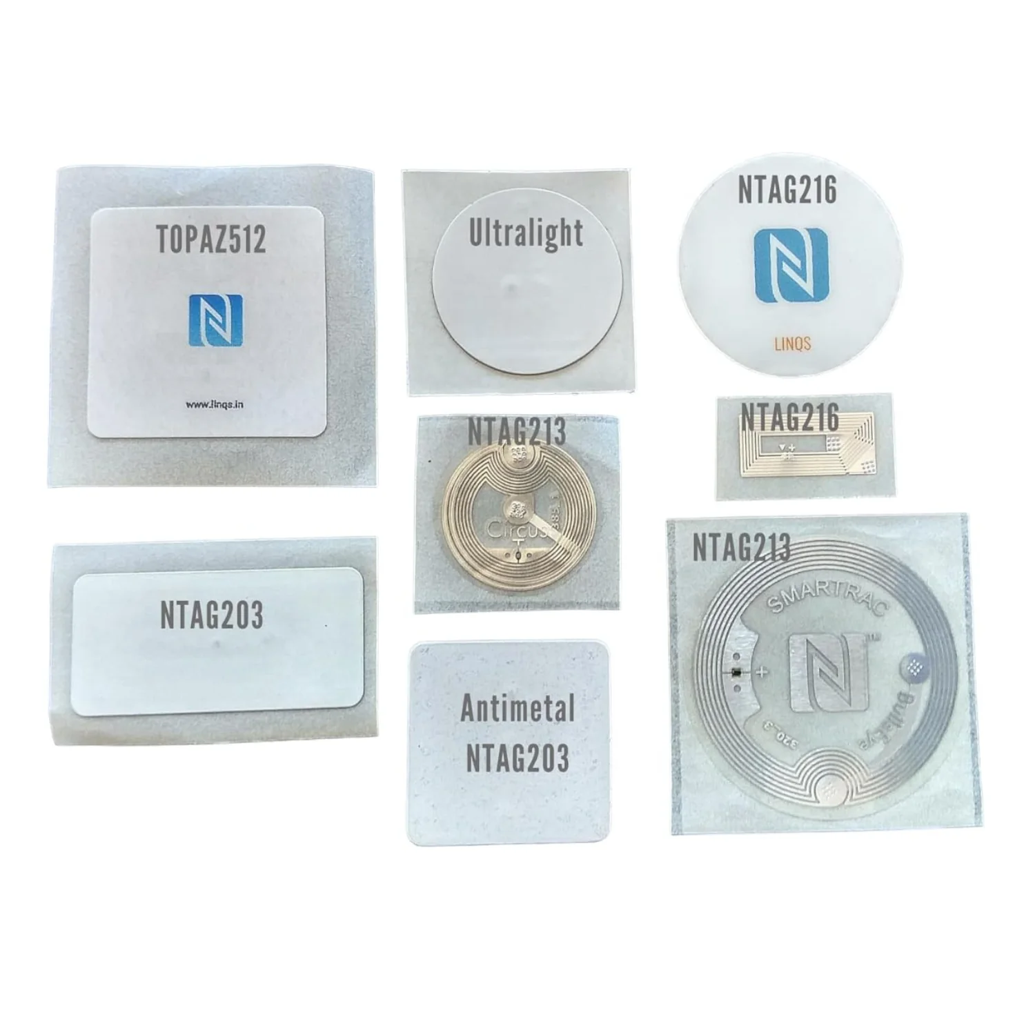 Assorted NFC stickers with various chip labels on a white background.