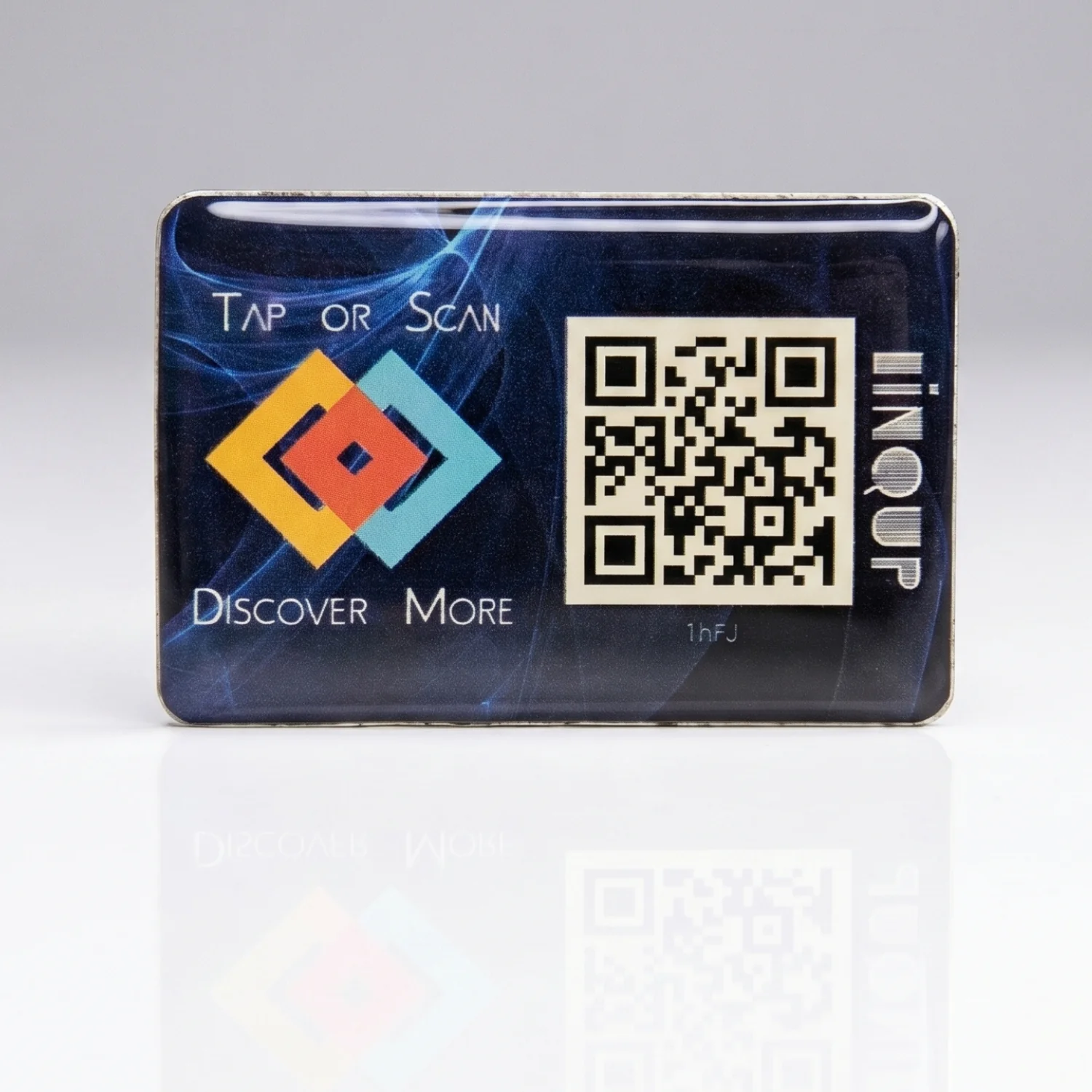Front view of LINQS Smart NFC and QR dynamic sticker on a reflective surface